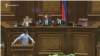 Opposition lawmaker Gevork Petrosian (at the podium) and Parliament Speaker Ararat Mirzoyan (in the center on the tribune) during a heated exchange over an initiative to ban same-sex marriages. November 12, 2019