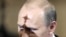 Russia -- Prime Minister Vladimir Putin has a shadow of a church symbol cast on his face as he attends the Archbishops congress in Moscow, 28Jun2008