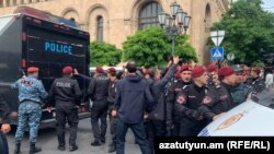 Armenia - Riot police detain protesters blocking a street in Yerevan, May 14, 2024.