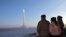 North Korean leader Kim Jong Un watches a test launch of an intercontinental ballistic missile in December.