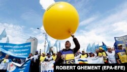 Romanian teachers chant anti-government slogans during a union protest in front of government headquarters in Bucharest on May 10.