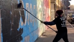 Exiled Expression: A Russian Street Artist's Defiant Political Activism From Abroad 