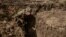 A soldier practices a trench assault, a type of warfare that is at the heart of Ukrainian attempts to break through Russian defenses.