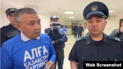 Kazakh activist Amangeldi Zhakhin (left) was jailed for 15 days. (file photo)