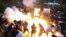 Armenia - A police stun grenade explodes during a rally against Prime Minister Nikol Pashinian in Yerevan, June 12, 2024. (Vahram Baghdasaryan/Photolur via AP)