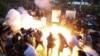 Armenia - Police fire a stun grenade at protesters in Yerevan, 22 April 2018.