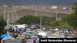 ARMENIA - Vehicles carrying refugees from Nagorno-Karabakh region queue on the road near the border village of Kornidzor, September 26, 2023.