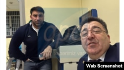 Russia - A lawyer for Azerbaijani man Kamil Zeynalli (left) takes a selfie with him following his arrest in Moscow, February 21, 2024.