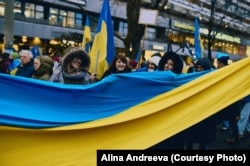 Українські біженці під час акції у Берліні, 2023 рік