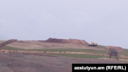 Azerbaijani soldiers set up positions near the Armenian village of Tegh, March 31, 2023.