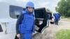 IAEA head Rafael Grossi stands next to his car at an undisclosed location in Ukraine on his way to visit the Zaporizhzhya nuclear power plant in Enerhnodar, Zaporizhzhya region, on June 15. 