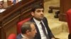Armeina -- Opposition deputy Mher Sahakian (right) attends a session of the Armenian parliament, April 11, 2023.