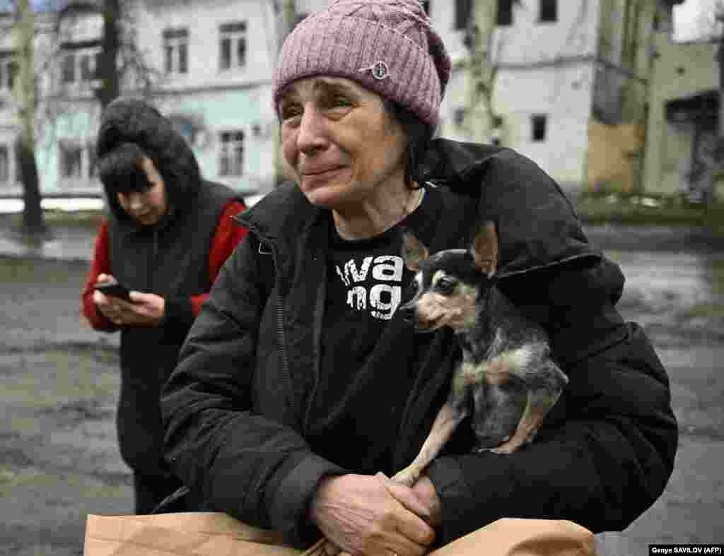 Lyuba cries as she clutches her trembling chihuahua, Margot, after being evacuated&nbsp;from Bakhmut by Ukrainian soldiers. &quot;We should have left earlier,&quot; she said after arriving safely in Chasiv Yar on April 3. &nbsp;