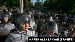 ARMENIA - Armenian riot police officers block a street during a rally against Armenian Prime Minister Pashinian in front of the Parliament building in Yerevan, 12 June 2024.