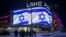 An Israeli national flag is seen on a screen at a shopping mall to support Israel in Kyiv on October 8.