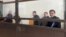 The activists appear in court in Almaty in February.