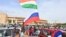 Supporters of Niger's National Council for the Safeguard of the Homeland wave Nigerien and Russian flags as they demonstrate in support of the military coup in Niamey on August 6.