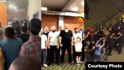 Котельникидеги тинтүүлөргө нааразылыгын билдирип, Орусиянын президенти Владимир Путинге кайрылып жаткан тажик мигранттары. Социалдык тармактарга тараган видеодон алынган кадр. 