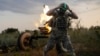 A Ukrainian soldier of the 3rd Separate Assault Brigade fires a 122mm mortar toward Russian positions at the front line near Bakhmut on July 2.