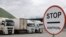 Vehicles waiting for border control on the Russian side of the Upper Lars crossing into Georgia (file photo)