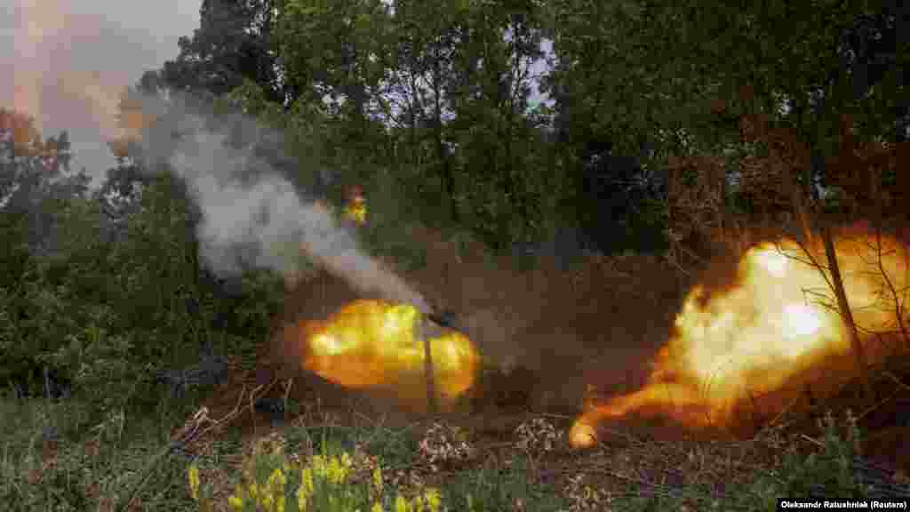 Ukrainian soldiers with the 57th Motorized Infantry Brigade fire a 2S1 Gvozdika self-propelled howitzer at Russian positions near Chasiv Yar.