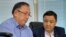 Qasym Amanzhol, the head of the Almaty bureau of RFE/RL's Kazakh Service, and lawyer Zhanghazy Kunserkin in court on October 12. 