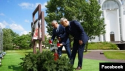 Ukraine - Armenian Ambassador Vladimir Karapetian and head of Yerevan's Nor Nork district, Tigran Ter-Margarian, visit Bucha, May 31, 2024.
