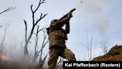 A Ukrainian soldier from the 28th Mechanized Brigade launches an RPG against Russian forces at the front line in the Bakhmut region on April 5.