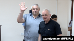 Armenia - Former Vanadzor Mayor Mamikon Aslanian (left) greets supporters during his trial in Yerevan, June 15, 2023.
