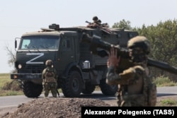 Російські зарабники у Запорізькій області України. 17 серпня 2023 року (Фото ТАСС)