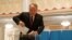 Former Kazakh President Nursultan Nazarbaev votes during the parliamentary election in Astana on March 19.