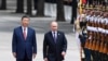 Chinese President Xi Jinpin (left) and Russian President Vladimir Putin as they review an honor guard during a visit to Beijing by the Russian leader last year. (file photo) 