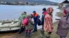 Residents of a village in Russia's Yakutia region are evacuated on May 13. 