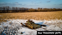 A destroyed Russian tank sits in a snow-covered wheat field in Ukraine's Kharkiv region on February 22.