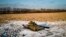 A destroyed Russian tank sits in a snow-covered wheat field in Ukraine's Kharkiv region on February 22.