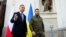 Polish President Andrzej Duda (left) and Ukrainian President Volodymyr Zelenskiy talk after a church service in Lutsk on July 9.