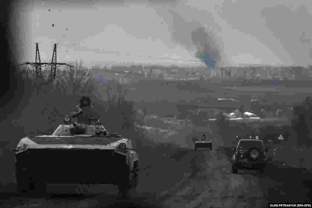 Ukrainian armored personnel carriers drive from the smoldering city of Bakhmut to Chasiv Yar on April 6. Ukraine&#39;s forces continue to transport critical troops and supplies into Bakhmut along the &quot;road of life,&quot; despite Moscow&#39;s assertion that it controls 75 percent of the ruined city.