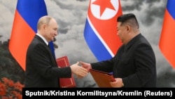 Уладзімір Пуцін І Кім Чэн Ын падчас падпісаньня дамовы. Пхэньян, 19 чэрвеня 2024 году