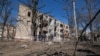 People visit the site of a Russian missile strike on a residential building in Kramatorsk on March 14. 