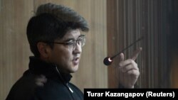 Quandyq Bishimbaev is accused of viciously beating his wife to death in a restaurant in November.
