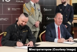 Олександр Камишін міністр стратегічних галузей промисловості України, та Ніколя Шамуссі з компанії Nexter Group. Київ, 29 вересня 2023 року