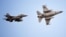 Винищувачі F-16 ВПС Румунії у повітрі біля Бази-86, неподалік від міста Фетешть. Румунія навчає українських пілотів керувати літаками F-16