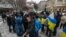 People gathered at the monument to Ukrainian poet Taras Shevchenko in Almaty as a sign of support for Ukraine on the second anniversary of Russia's full-scale invasion on February 24. 