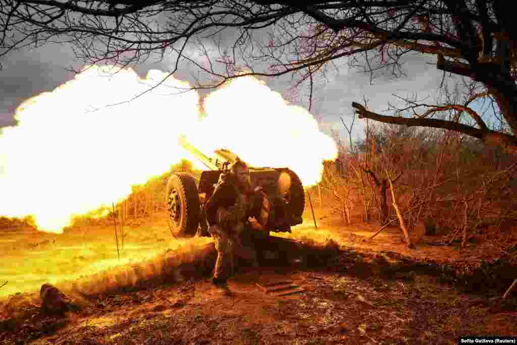 Ukrainian service members from the 3rd Separate Assault Brigade fire a D30 howitzer toward Russian positions near Bakhmut on April 23. Kyiv continues to hold its strategic positions in Bakhmut, a senior military commander said after Russia claimed it had made advances in the city. For months, Bakhmut has been the epicenter of fierce battles for control of the eastern Donetsk region.