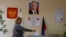 A woman casts her ballot at a polling station during elections held by the Russian-installed authorities in Donetsk on September 9.