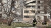Rescuers work at the scene after an apartment building was damaged by a Russian missile strike in Zaporizhzhya on March 22.