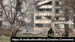 Rescuers work at the scene after an apartment building was damaged by a Russian missile strike in Zaporizhzhya on March 22.