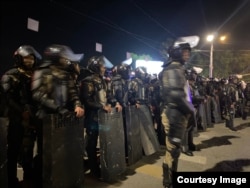 Riot police in Bishkek early on May 18