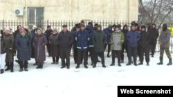 Relatives of striking workers gathered outside the mayor's office in Manghystau on December 16.