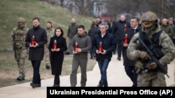 (Left to right) Slovakia's Prime Minister Eduard Heger, Moldova's President Maia Sandu, Ukrainian President Volodymyr Zelenskiy, Slovenia's Prime Minister Robert Golob, and Croatia's Prime Minister Andrej Plenkovic attend an event to mark the liberation of Bucha on March 31.